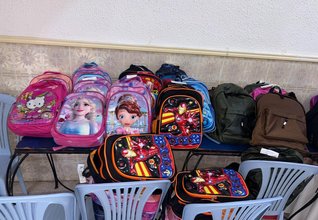 A schoolbag, a smile, a future